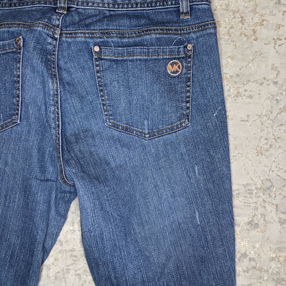 Michael Kors cropped distressed jeans.